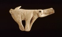 A spear-thrower made from reindeer antler, sculpted as a mammoth and about 13,000-14,000 years old, found in the rock shelter of Montastruc, France.  Copyright of The Trustees of the British Museum