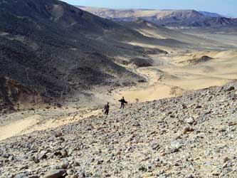 Metal detectorists set off across the desert.